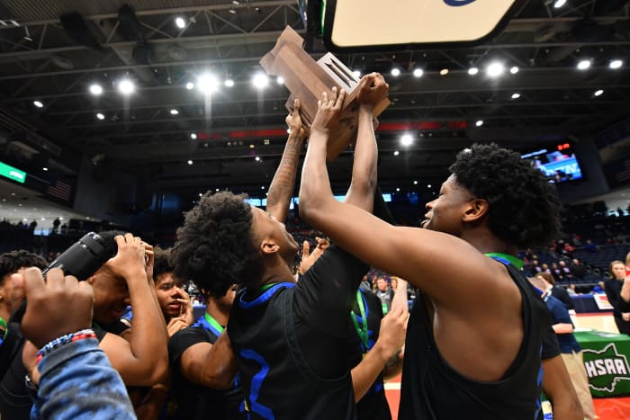 Richmond Heights players lift the 2023 OHSAA Division IV state championship trophy